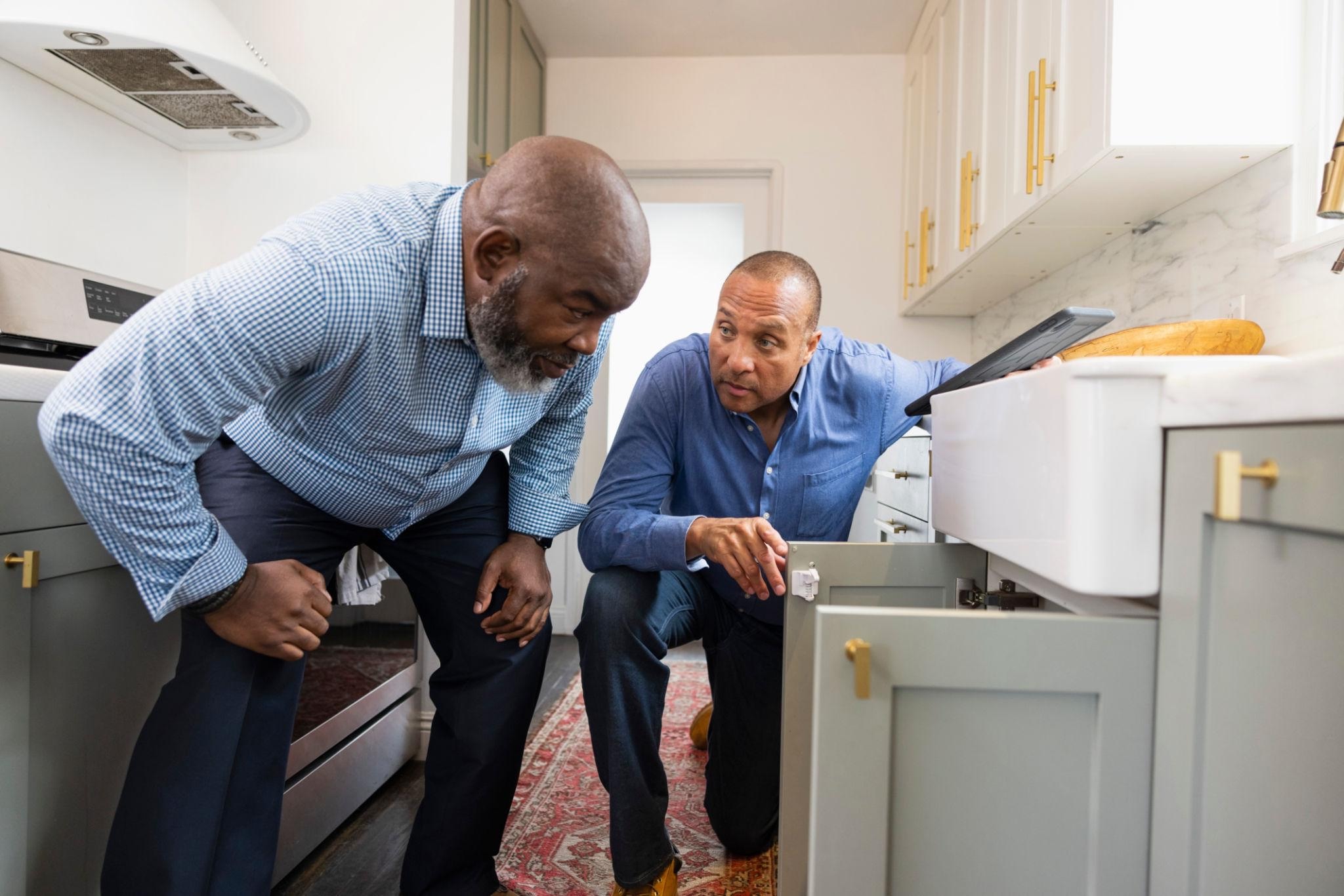 Contractor showing homeowner a kitchen remodeling project